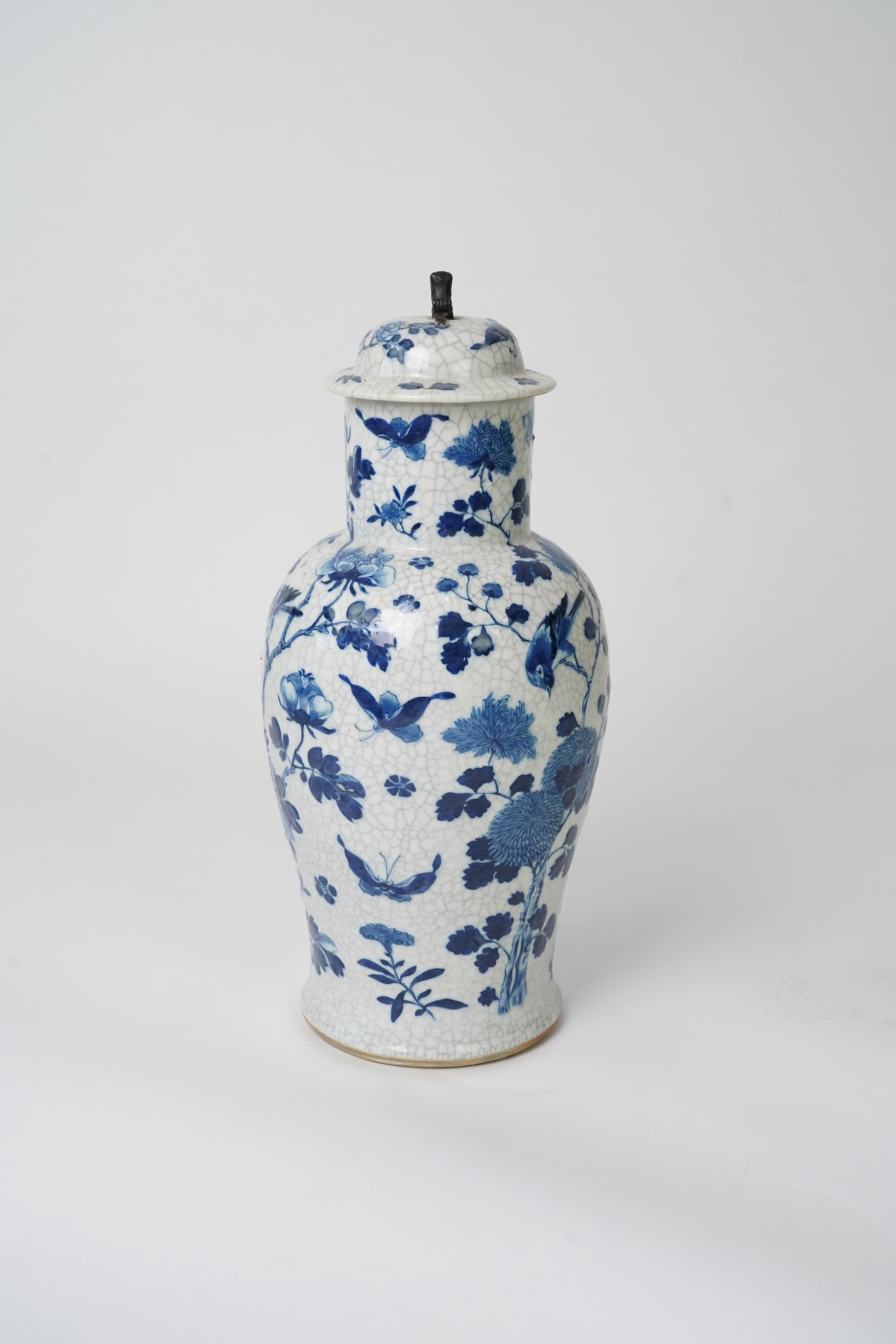 A Chinese blue and white crackle glaze baluster vase and cover, early 20th century